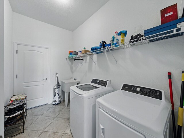 1547 Cordgrass Way, Lakeland, FL 33813 - washroom with separate washer and dryer and light tile patterned floors