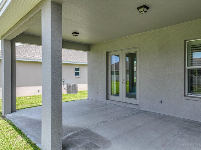 1547 Cordgrass Way, Lakeland, FL 33813 - view of patio / terrace with french doors and central air condition unit