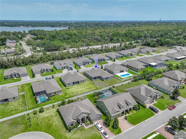 1547 Cordgrass Way, Lakeland, FL 33813 - aerial perspective of suburban area with a nearby body of water and a forest