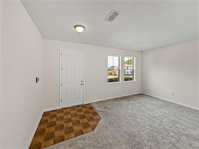 143 Alfani St, Davenport, FL 33896 - foyer with carpet, a textured ceiling, and baseboards