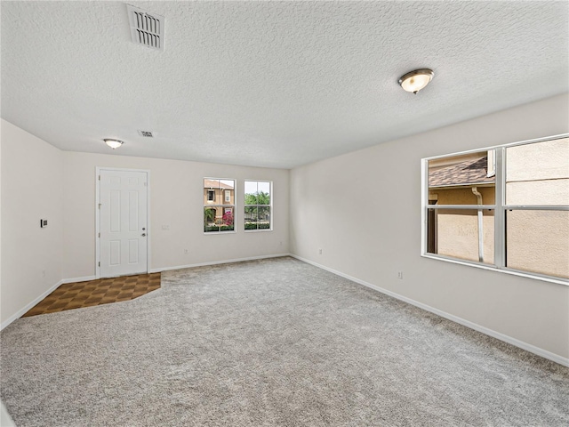 143 Alfani St, Davenport, FL 33896 - carpeted empty room with baseboards and a textured ceiling