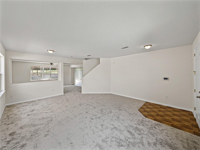143 Alfani St, Davenport, FL 33896 - carpeted spare room featuring baseboards and a textured ceiling