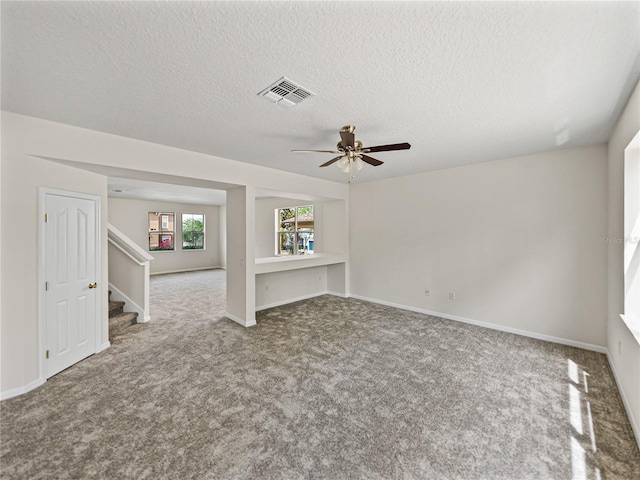 143 Alfani St, Davenport, FL 33896 - carpeted spare room featuring stairway, a ceiling fan, a textured ceiling, and baseboards