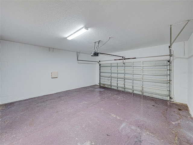 143 Alfani St, Davenport, FL 33896 - garage featuring concrete block wall and a garage door opener