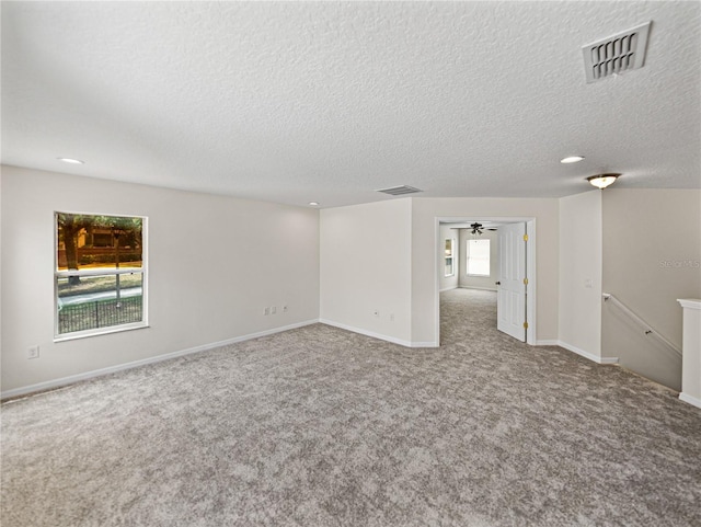 143 Alfani St, Davenport, FL 33896 - empty room featuring carpet, baseboards, a textured ceiling, and ceiling fan