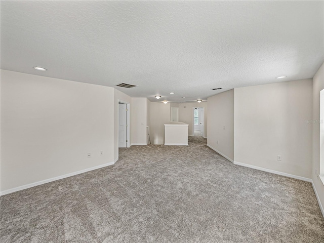 143 Alfani St, Davenport, FL 33896 - unfurnished living room featuring carpet, recessed lighting, a textured ceiling, and baseboards
