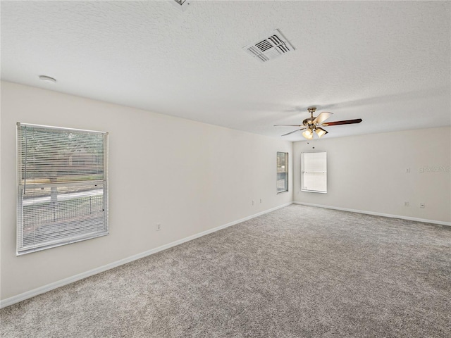 143 Alfani St, Davenport, FL 33896 - unfurnished room with carpet, ceiling fan, baseboards, and a textured ceiling
