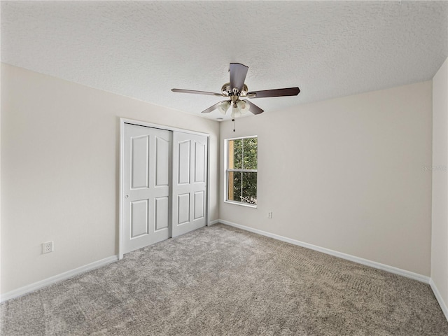 143 Alfani St, Davenport, FL 33896 - unfurnished bedroom with a closet, carpet floors, baseboards, a textured ceiling, and ceiling fan