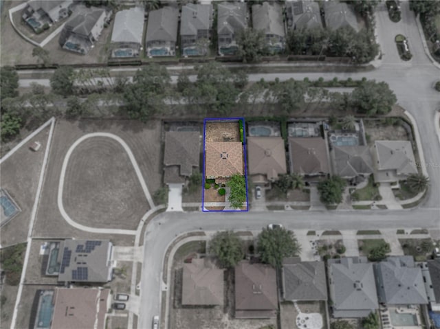 143 Alfani St, Davenport, FL 33896 - aerial view of property and surrounding area featuring nearby suburban area and property parcel outlined