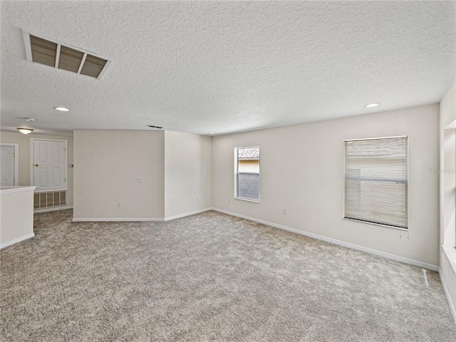 143 Alfani St, Davenport, FL 33896 - empty room with carpet, a textured ceiling, baseboards, and recessed lighting