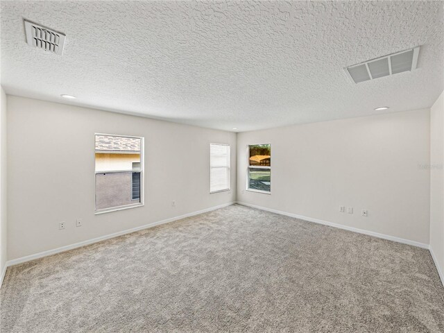 143 Alfani St, Davenport, FL 33896 - spare room featuring carpet, a textured ceiling, and baseboards