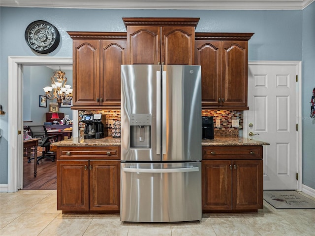 148 Melissa Trl, Auburndale, FL 33823 - kitchen featuring stainless steel fridge with ice dispenser, decorative backsplash, an office area, light tile patterned floors, and stone counters