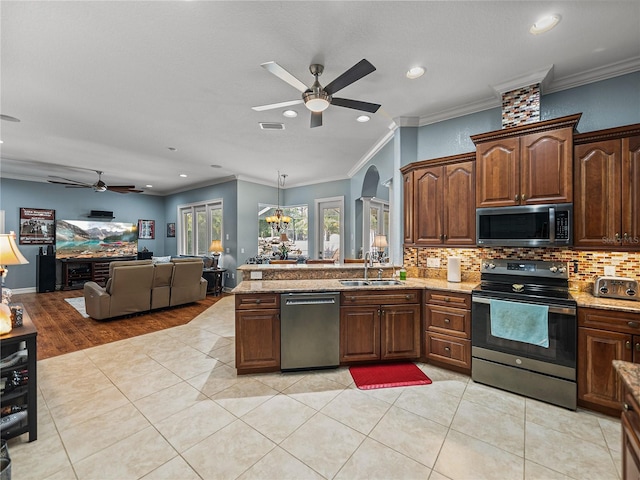 148 Melissa Trl, Auburndale, FL 33823 - kitchen featuring appliances with stainless steel finishes, a ceiling fan, a sink, recessed lighting, and backsplash