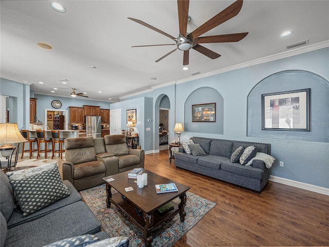 148 Melissa Trl, Auburndale, FL 33823 - living room with a ceiling fan, crown molding, wood finished floors, recessed lighting, and arched walkways