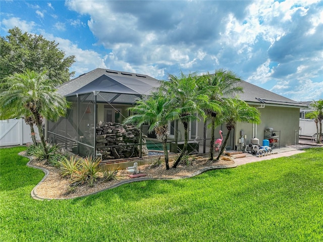 148 Melissa Trl, Auburndale, FL 33823 - rear view of house with a patio, a gate, and a lanai