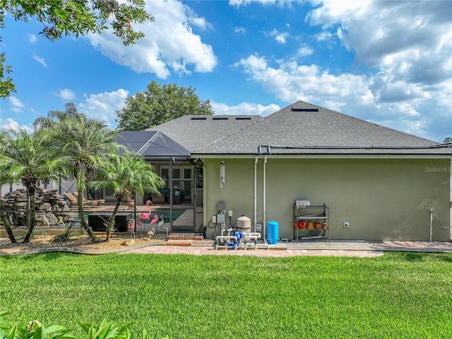 148 Melissa Trl, Auburndale, FL 33823 - back of house with roof with shingles, stucco siding, a patio, a yard, and a lanai