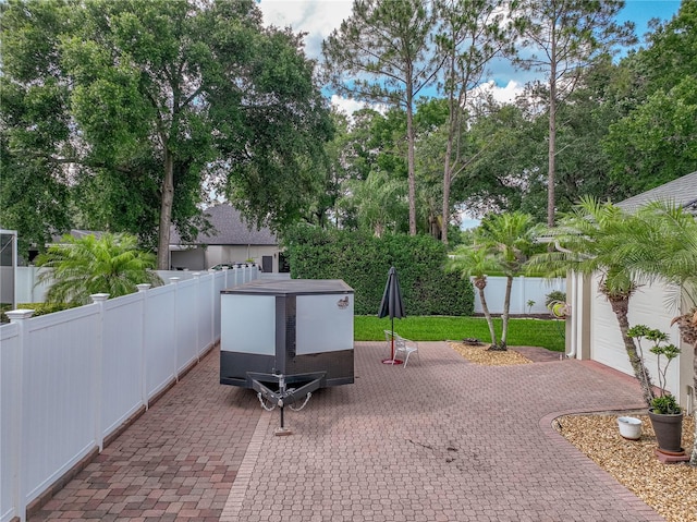 148 Melissa Trl, Auburndale, FL 33823 - fenced backyard with a patio and view of scattered trees