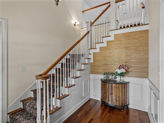 184 Melissa Trl, Auburndale, FL 33823 - stairway with hardwood / wood-style flooring, wainscoting, and a decorative wall