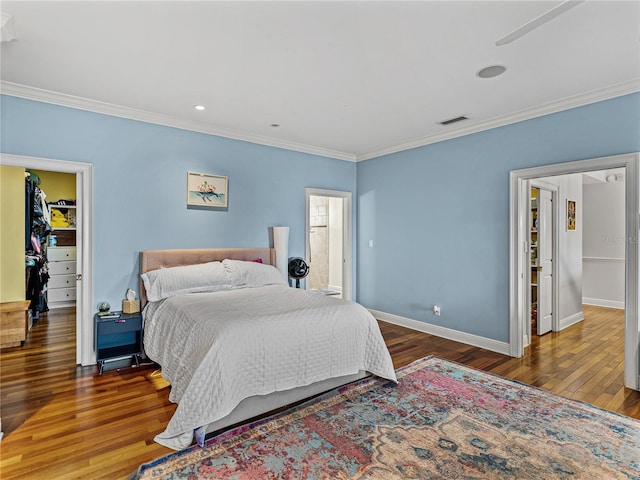 184 Melissa Trl, Auburndale, FL 33823 - bedroom featuring ornamental molding, wood finished floors, baseboards, recessed lighting, and a walk in closet