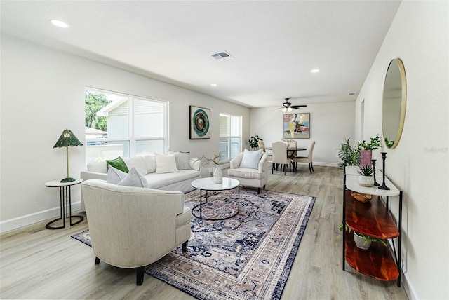 6338 Oak Sq E, Lakeland, FL 33813 - living room featuring a ceiling fan, light wood-style floors, baseboards, and recessed lighting