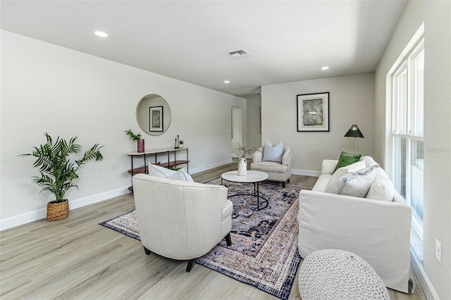 6338 Oak Sq E, Lakeland, FL 33813 - living room featuring wood finished floors, recessed lighting, and baseboards