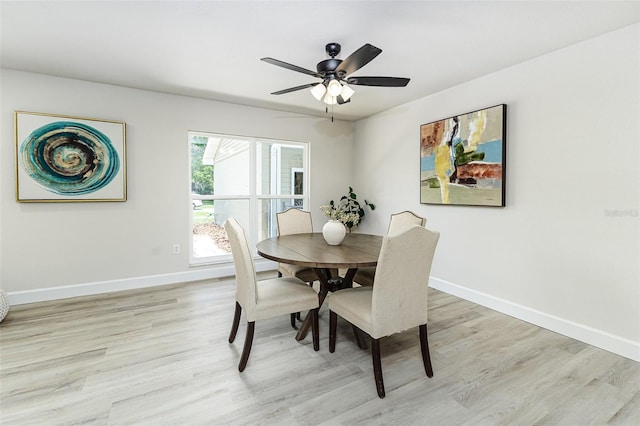 6338 Oak Sq E, Lakeland, FL 33813 - dining space featuring light wood-style floors, baseboards, and a ceiling fan