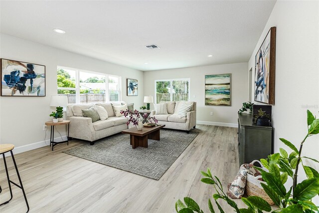 6338 Oak Sq E, Lakeland, FL 33813 - living area featuring baseboards, light wood finished floors, and recessed lighting