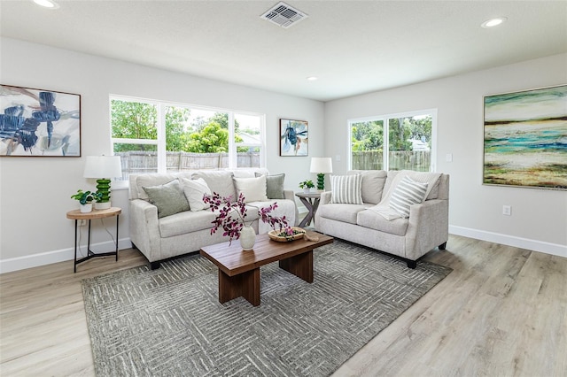 6338 Oak Sq E, Lakeland, FL 33813 - living room with light wood-style flooring, baseboards, and recessed lighting