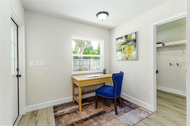 6338 Oak Sq E, Lakeland, FL 33813 - home office featuring wood finished floors and baseboards