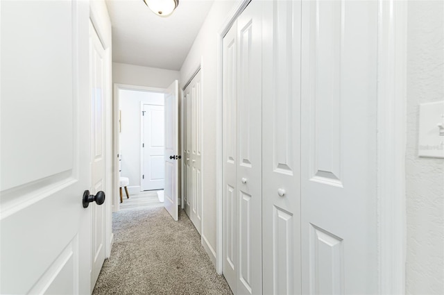 6338 Oak Sq E, Lakeland, FL 33813 - hall with light carpet and baseboards