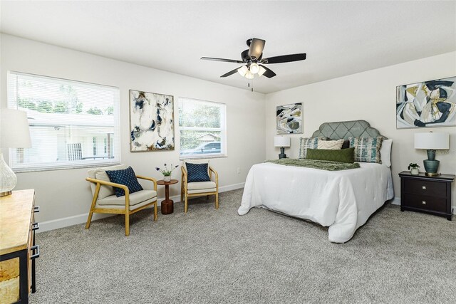 6338 Oak Sq E, Lakeland, FL 33813 - carpeted bedroom with baseboards and a ceiling fan