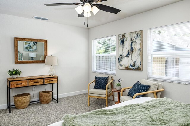6338 Oak Sq E, Lakeland, FL 33813 - carpeted bedroom with baseboards and a ceiling fan