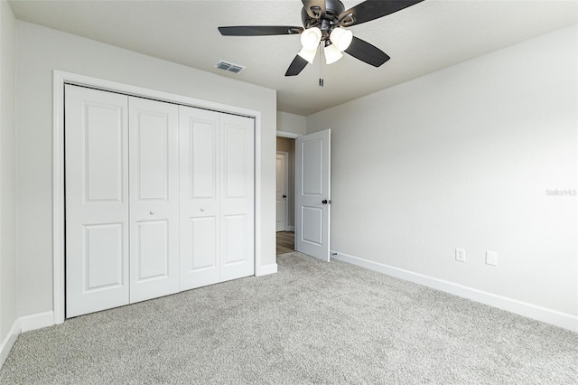 6338 Oak Sq E, Lakeland, FL 33813 - unfurnished bedroom featuring carpet floors, baseboards, and a closet