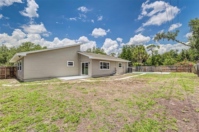 6338 Oak Sq E, Lakeland, FL 33813 - back of property featuring a patio area and central AC unit