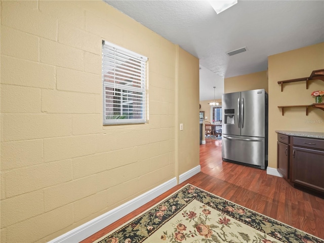 2921 W Socrum Loop Rd, Lakeland, FL 33810 - kitchen with stainless steel fridge with ice dispenser, dark wood-style flooring, light countertops, baseboards, and open shelves
