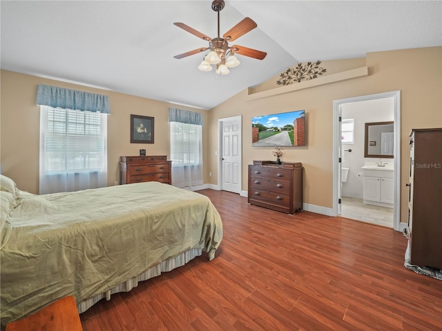 2921 W Socrum Loop Rd, Lakeland, FL 33810 - bedroom featuring vaulted ceiling, wood finished floors, a sink, baseboards, and ceiling fan