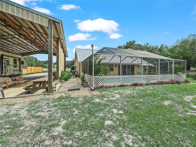 2921 W Socrum Loop Rd, Lakeland, FL 33810 - view of green lawn featuring a patio and a lanai