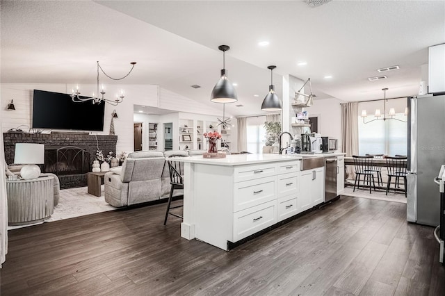 7608 Franklin Rd, Plant City, FL 33565 - kitchen featuring a chandelier, a sink, open floor plan, dark wood-type flooring, and lofted ceiling