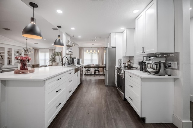 7608 Franklin Rd, Plant City, FL 33565 - kitchen with appliances with stainless steel finishes, healthy amount of natural light, a chandelier, a sink, and recessed lighting