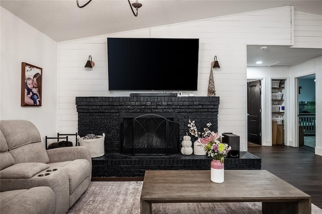 7608 Franklin Rd, Plant City, FL 33565 - living area with vaulted ceiling, wood finished floors, wood walls, and a fireplace