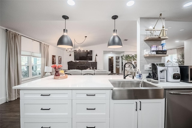 7608 Franklin Rd, Plant City, FL 33565 - kitchen featuring stainless steel dishwasher, a sink, open shelves, open floor plan, and light countertops