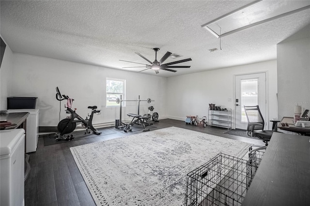 7608 Franklin Rd, Plant City, FL 33565 - workout room featuring attic access, dark wood-style floors, a textured ceiling, baseboards, and a ceiling fan