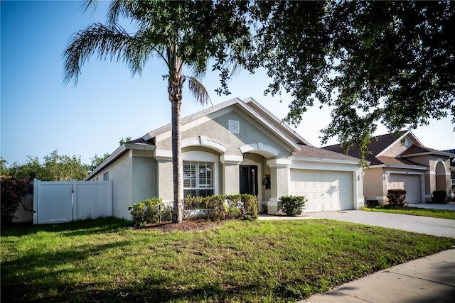 11567 Misty Isle Ln, Riverview, FL 33579 - single story home featuring an attached garage, concrete driveway, and stucco siding