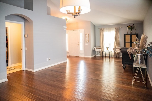 11567 Misty Isle Ln, Riverview, FL 33579 - entryway featuring arched walkways, wood finished floors, and baseboards