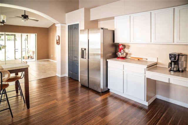 11567 Misty Isle Ln, Riverview, FL 33579 - kitchen featuring stainless steel refrigerator with ice dispenser, arched walkways, dark wood-style flooring, white cabinetry, and ceiling fan