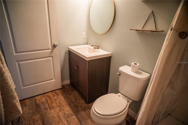 11567 Misty Isle Ln, Riverview, FL 33579 - bathroom featuring vanity, wood finished floors, and toilet