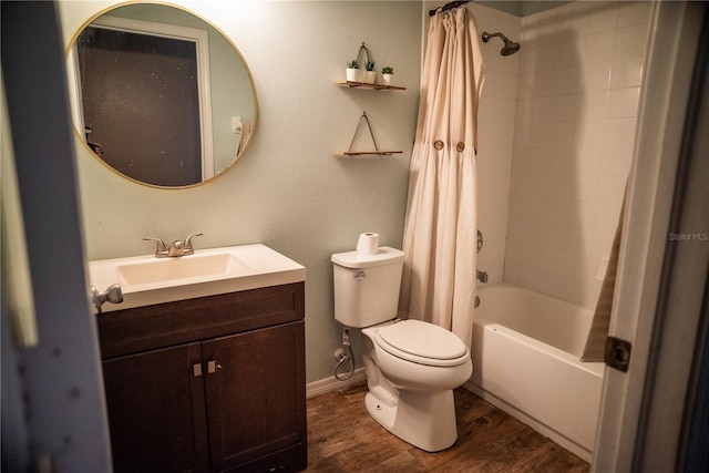 11567 Misty Isle Ln, Riverview, FL 33579 - bathroom with toilet, vanity, shower / tub combo with curtain, wood finished floors, and baseboards
