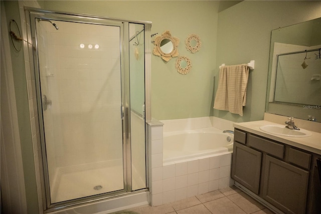 11567 Misty Isle Ln, Riverview, FL 33579 - full bath featuring a stall shower, a garden tub, vanity, and tile patterned floors