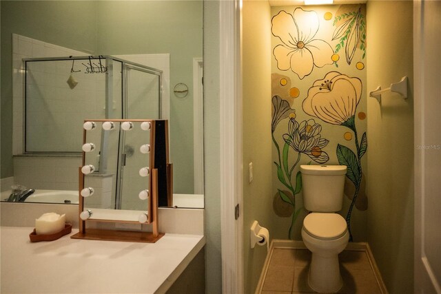 11567 Misty Isle Ln, Riverview, FL 33579 - bathroom featuring toilet, a stall shower, vanity, and tile patterned flooring