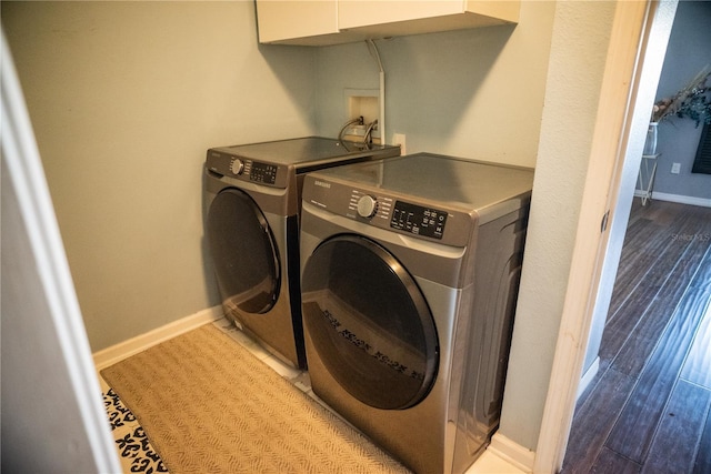 11567 Misty Isle Ln, Riverview, FL 33579 - laundry area featuring washing machine and dryer, baseboards, and wood finished floors